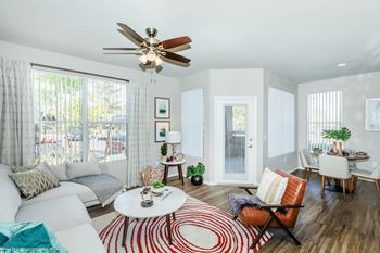 Living room with couch at The Equestrian by Picerne, Henderson, NV